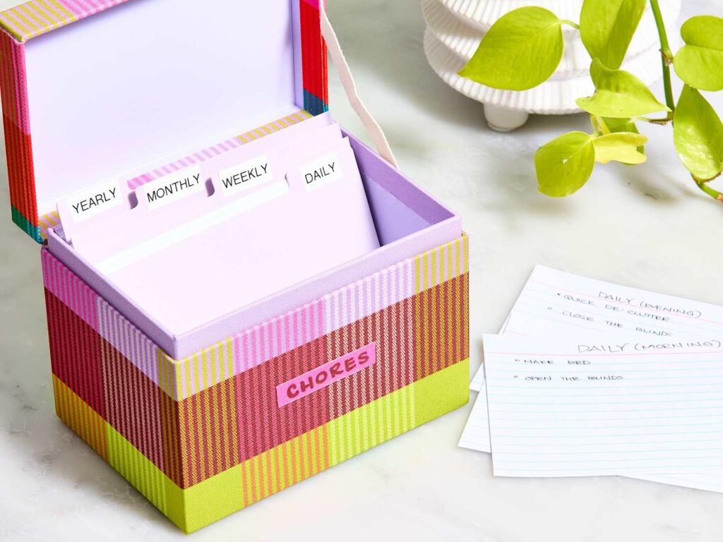The Home Index Card System printable featuring a 3×5 index card file box with numbered dividers and task cards for organizing daily, weekly, and monthly household chores and reminders.